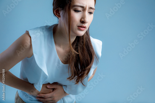 young woman having a stomachache photo