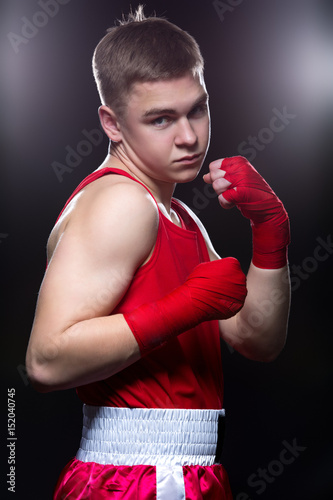 Young boxer in red form © svetography