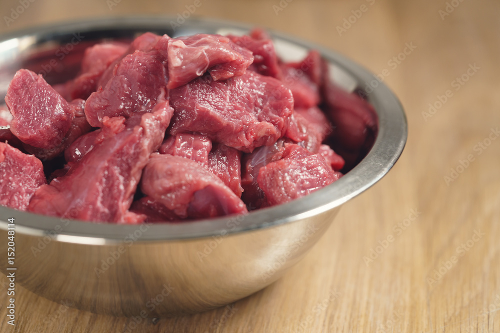 raw beef in bowl closeup, shallow focus raw beef in bowl closeup, shallow focus