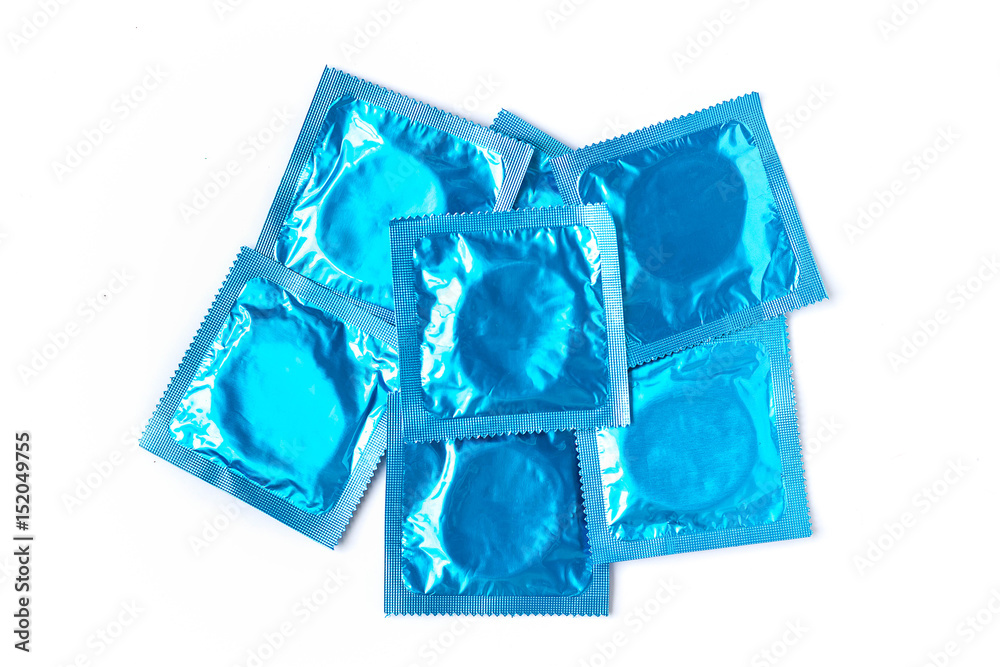 Condom packs on white background Condom packs on white background