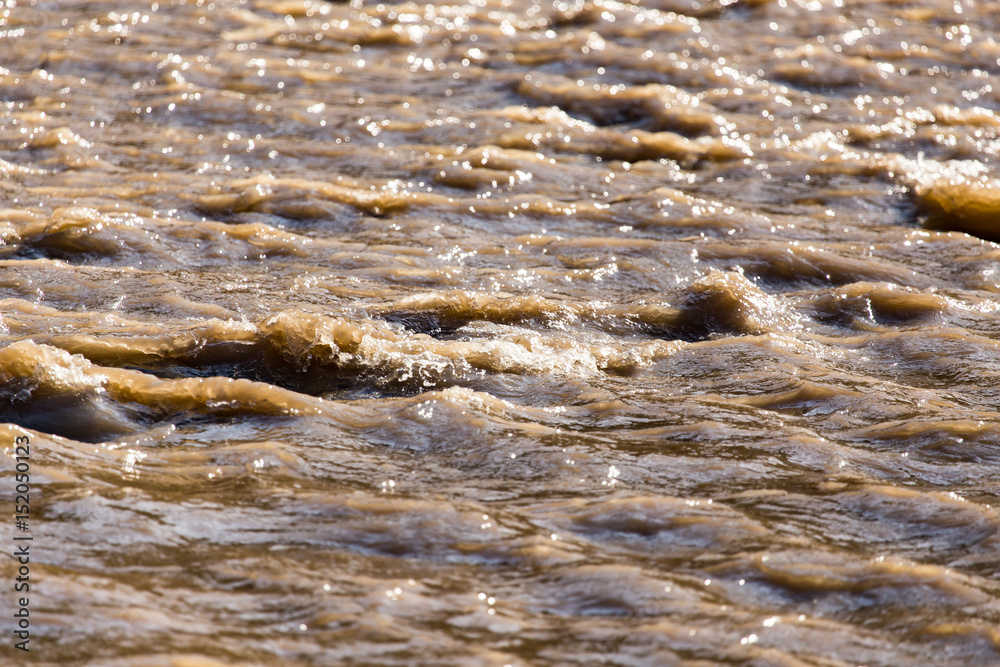 Dirty water in a stormy river as a background Dirty water in a stormy river as a background