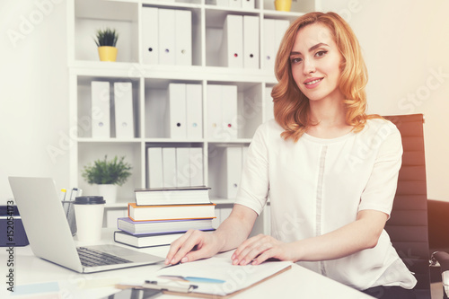 Cheerful red haired businesswoman