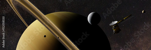 Saturn's moon Enceladus and spacecraft Cassini–Huygens in front of planet Saturn, rings and other moons and the stars photo