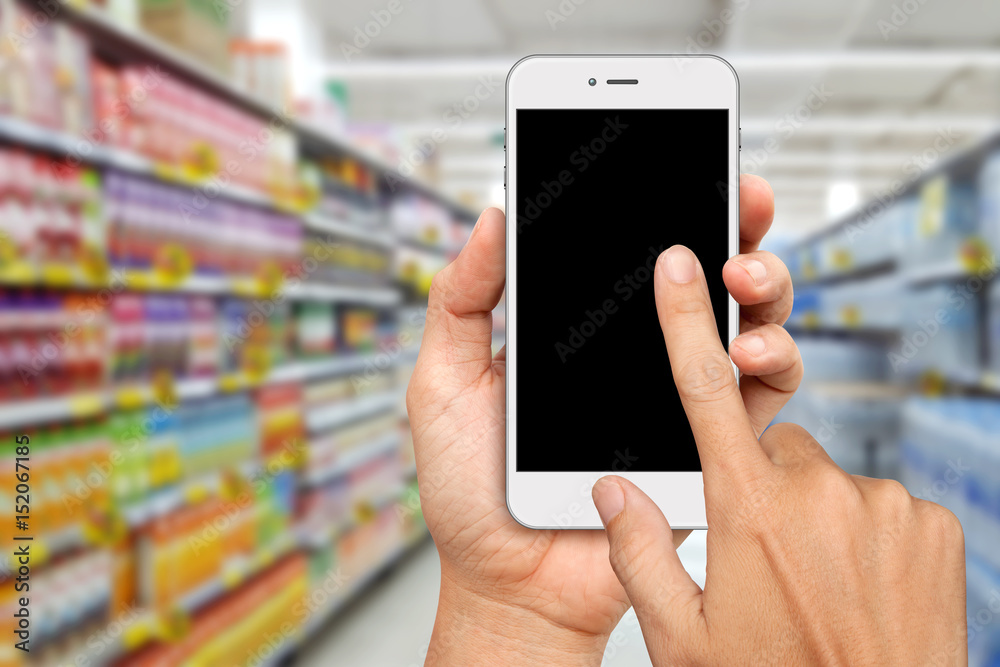 Hand holding and Touch on White Smartphone for online shopping concept Hand holding and Touch on White Smartphone for online shopping concept