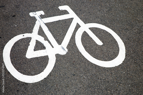 Drawing a bicycle on the asphalt 