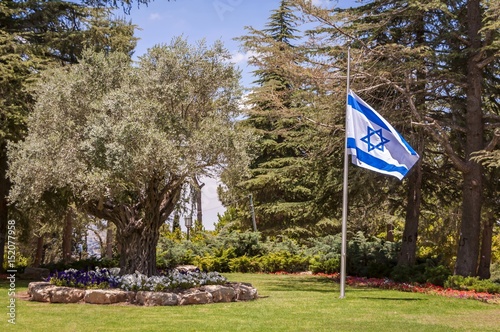 JERUSALEM, ISRAEL. June 10, 2016. Israel's national cemetery at the Mount Herzl in Jerusalem, where most Israeli national leaders are buried. Israeli flag at half-mast stock image. photo