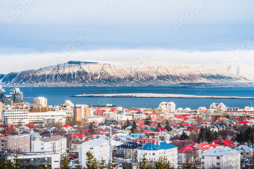 Beautiful view of  Reykjavik winter in Iceland winter season with snow-capped mountain in the background, Reykjavík is the capital city of Iceland.with snow-capped mountain in the background. photo