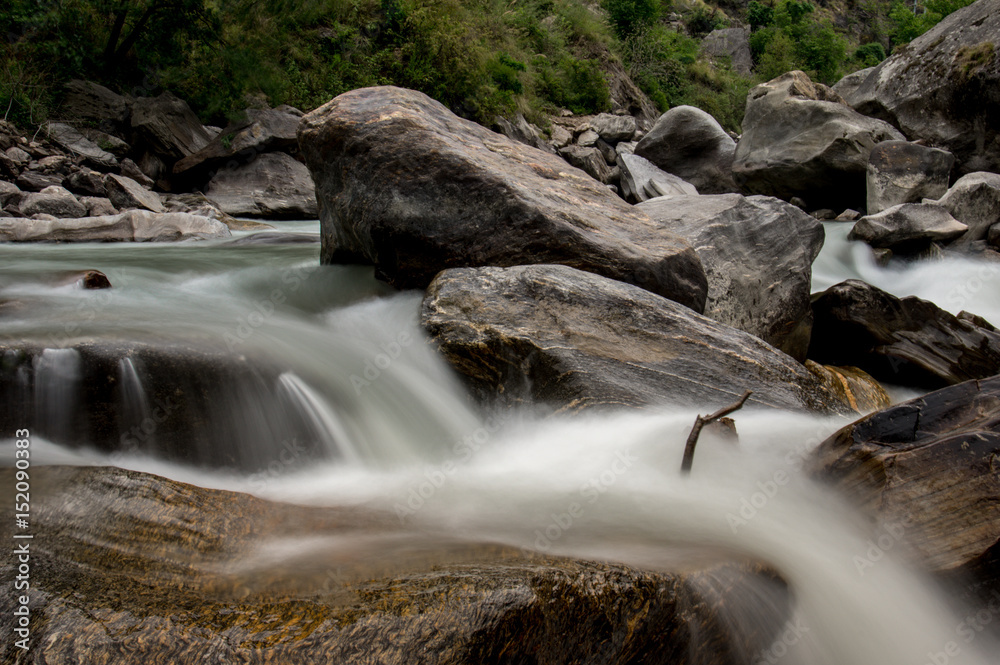 Fototapeta premium Blurred Motion of Water over Rocks
