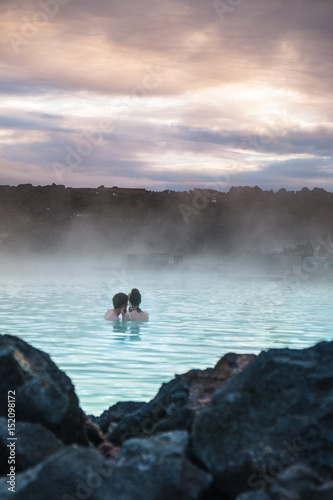 Relaxation concept.  Adult couple relaxing outdoor famous spa retreat in Blue Lagoon, Iceland.