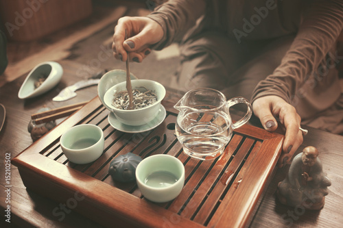 young beautiful blonde woman making tea ceremony