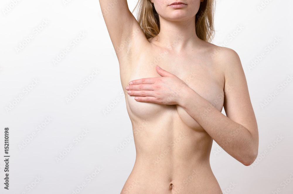 Topless woman covering her breast Topless woman covering her breast