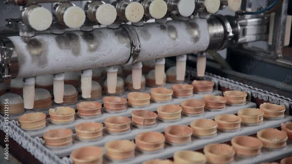 The filling of the ice-cream cones. Close-up. HD. The filling of the ice-cream cones. Close-up. HD.