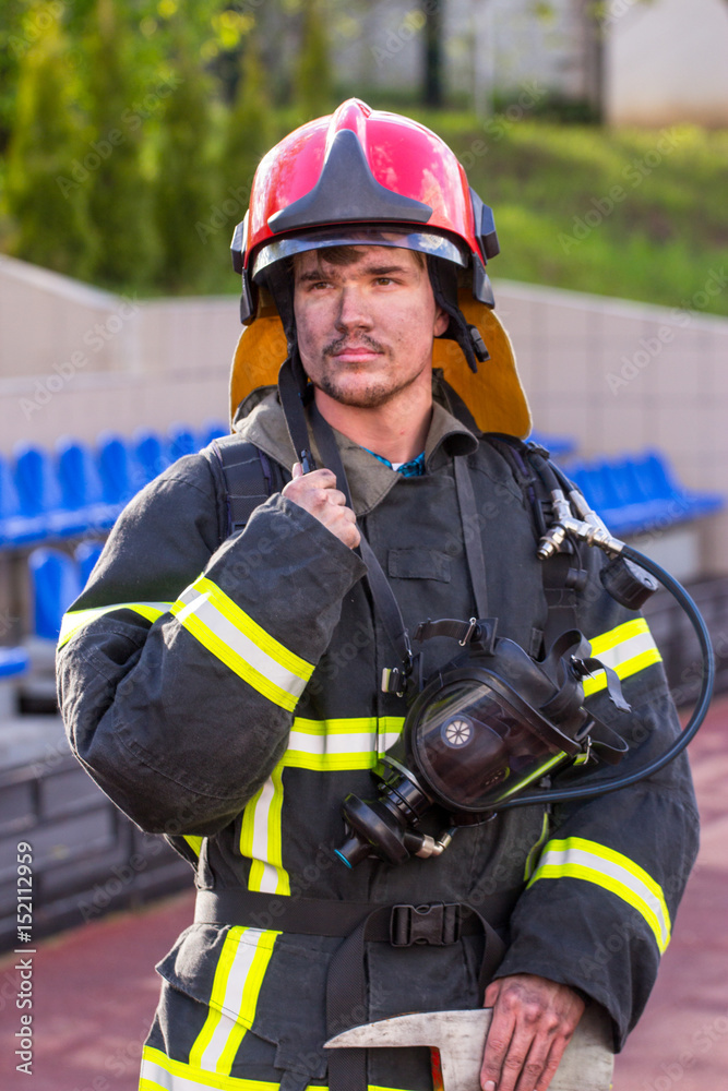 Portrait of a fireman with an axe Portrait of a fireman with an axe