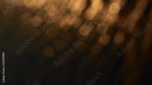 Abstract sparkling light bokeh movement, Sunset light reflection on water surface
