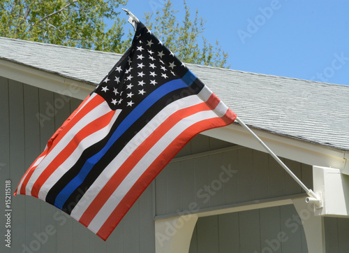 United States flag with blue line to honor police and law enforcement officers photo