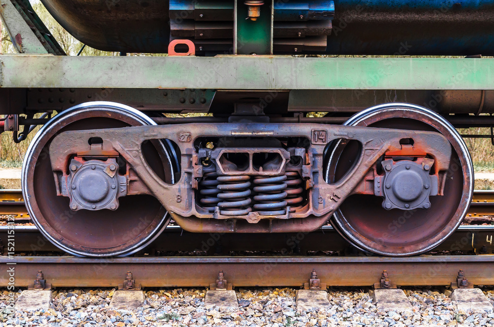Fototapeta premium Industrial rail train wheels closeup technology train rail road.