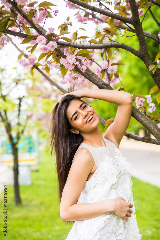 beautiful young woman take photo with blooming cherry blossoms sakura flowers beautiful young woman take photo with blooming cherry blossoms sakura flowers