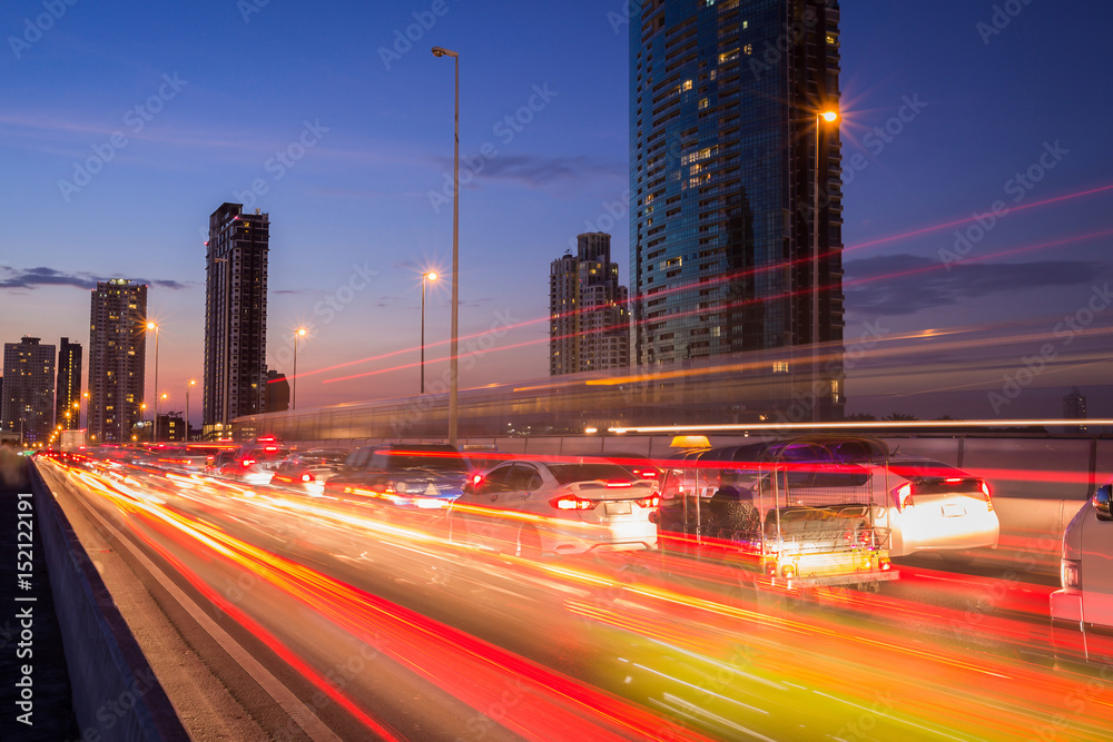 Fototapeta premium The light trails on the street and urban in the twilight or dusk as city life background.