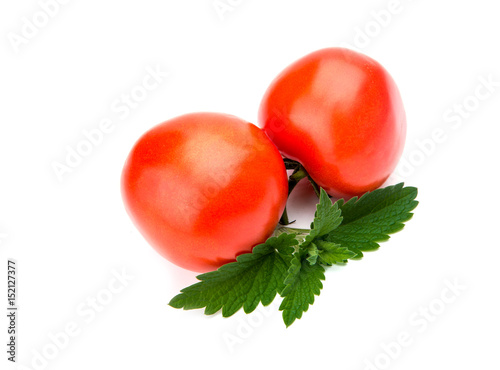 one fresh red tomato isolated on white photo