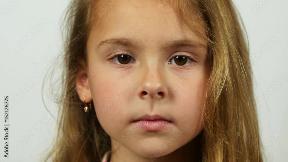 Extremely close up portrait girl. Teen girl looking at camera calmly. Extremely close up portrait girl. Teen girl looking at camera calmly.