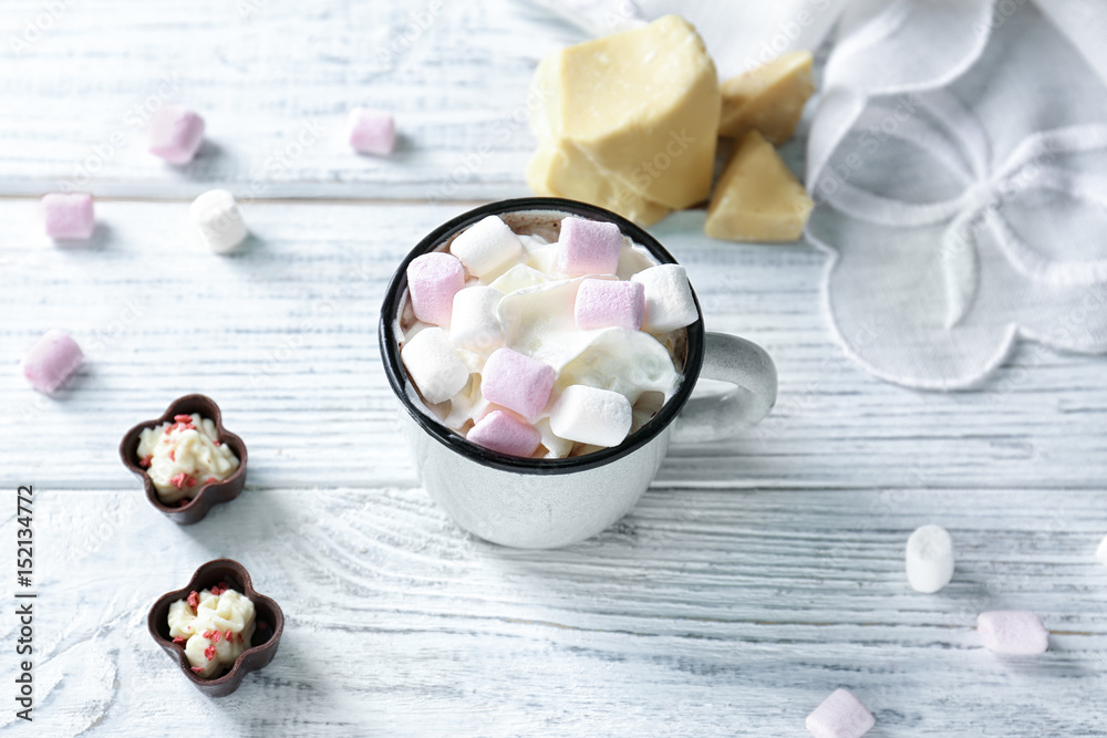 Cup of hot cocoa with marshmallows on wooden table Cup of hot cocoa with marshmallows on wooden table