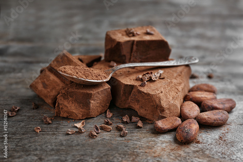 Composition of cocoa products on wooden background