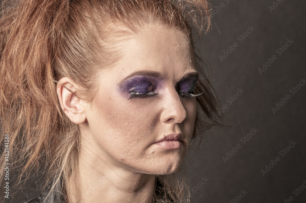 Portrait of a beautiful young red curly girl with bright makeup
Portrait of a beautiful young red curly girl with bright makeup
