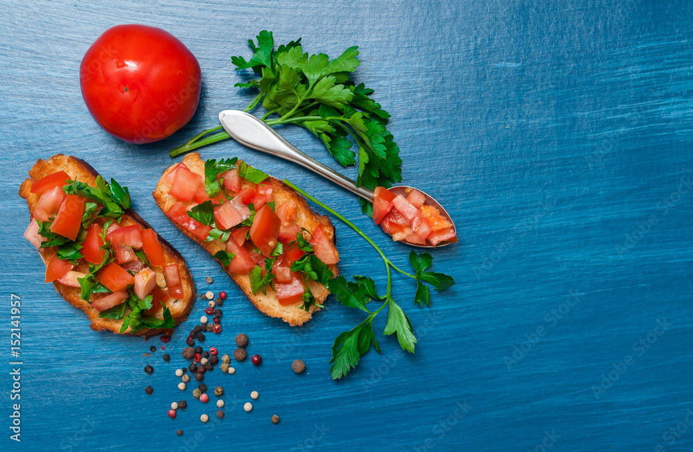 Italian food, tomato bruschetta. Top view with space for text. Italian food, tomato bruschetta. Top view with space for text.