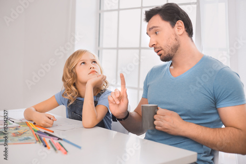 Young man father drawing with kid creativity development