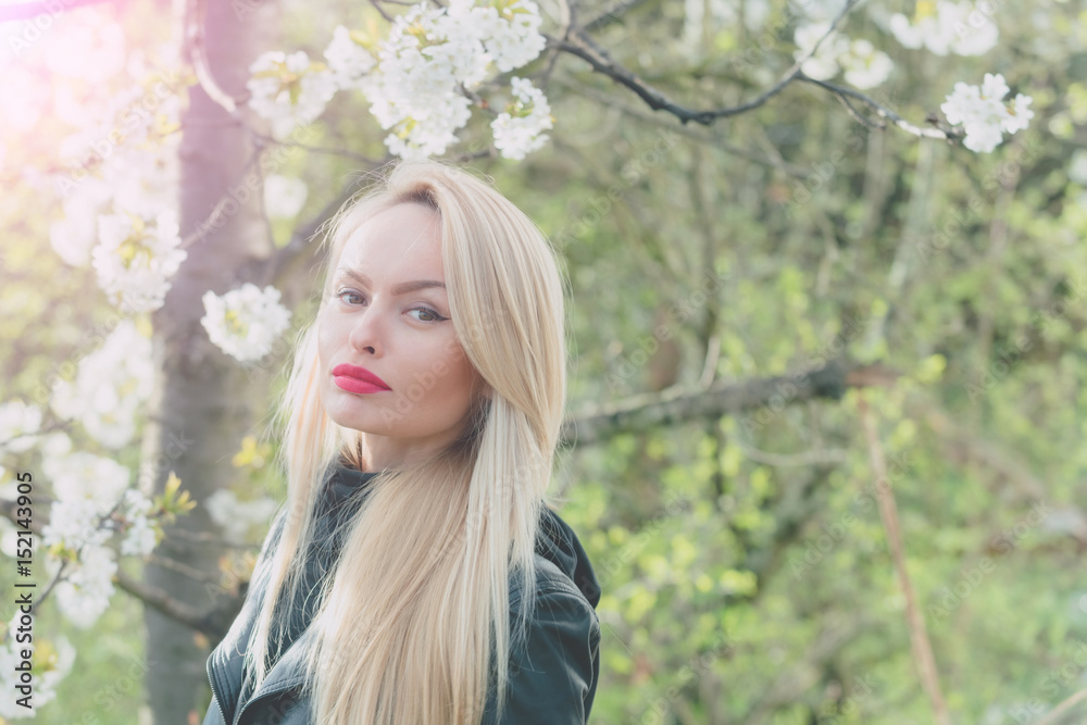 pretty girl with red lips and blonde hair in blossom pretty girl with red lips and blonde hair in blossom
