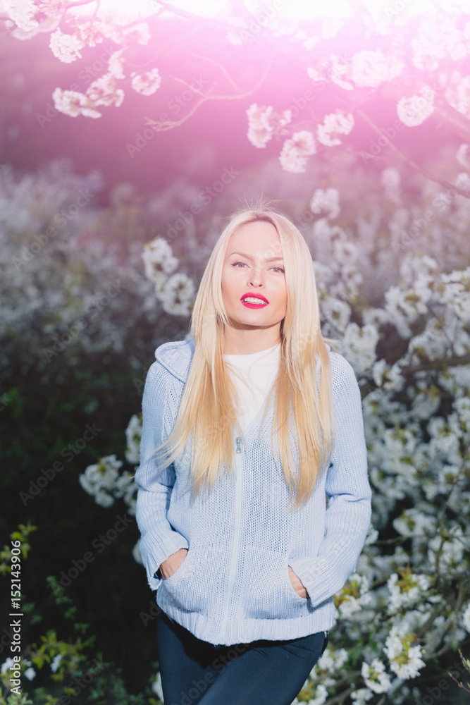 beauty portrait, beautiful blonde woman in spring flowers blossom beauty portrait, beautiful blonde woman in spring flowers blossom