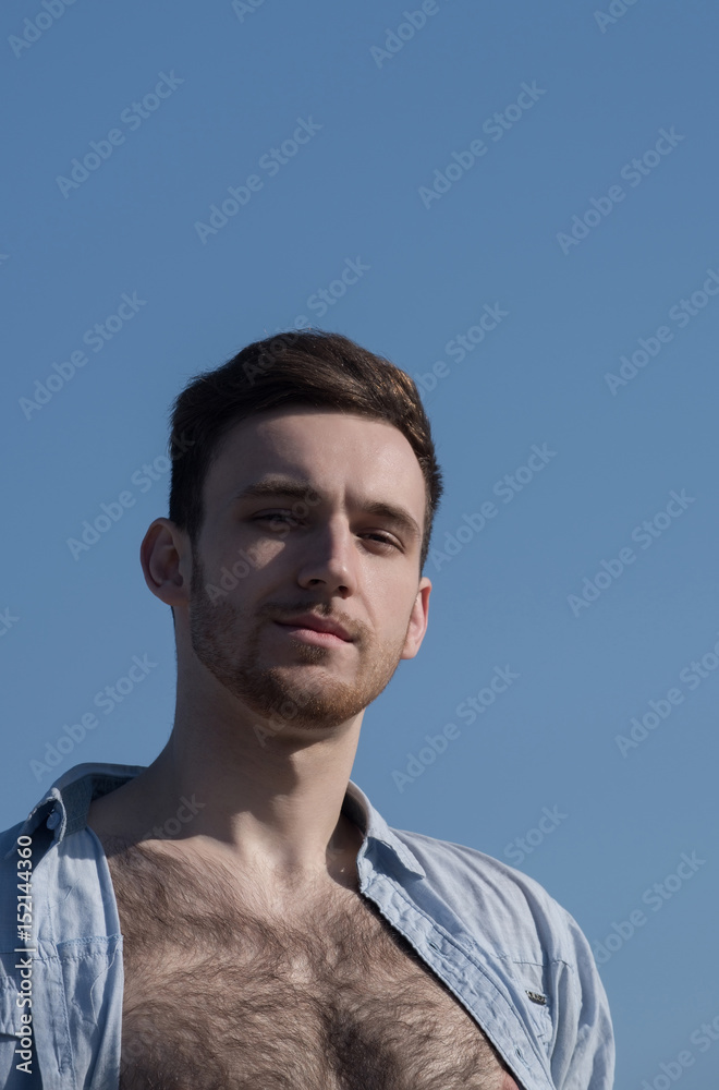 Handsome Man Posing In Unbutton Shirt With Naked Hairy Chest Stock