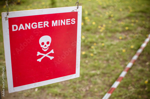 Warning sign - Danger mines on a forest
