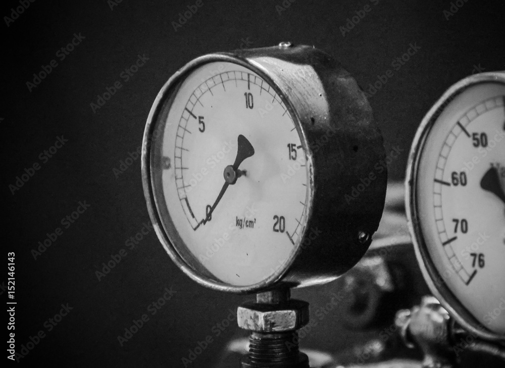Pressure gage manometer,measuring water pressure pipe and valves on the background. Pressure gage manometer,measuring water pressure pipe and valves on the background.