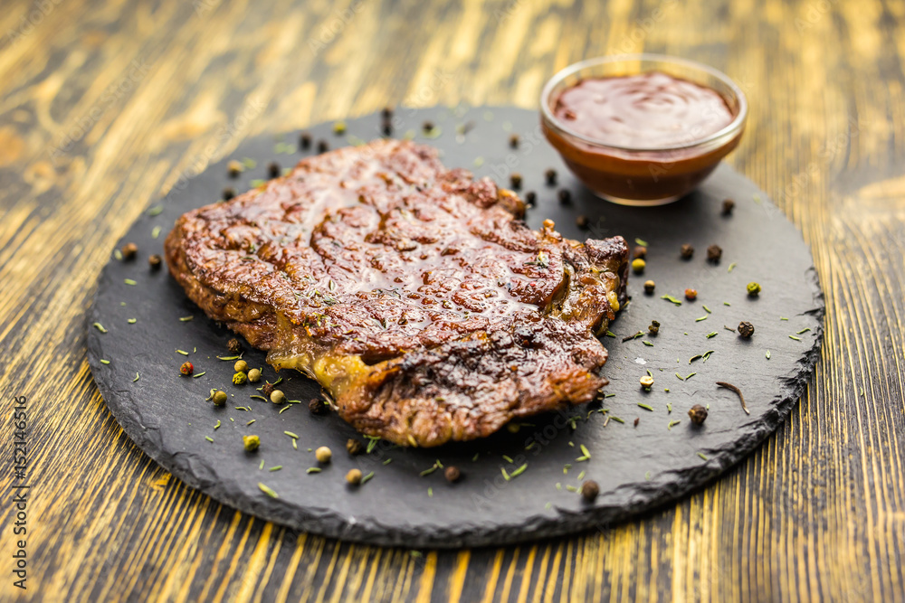 Grilled beef steak with sauce