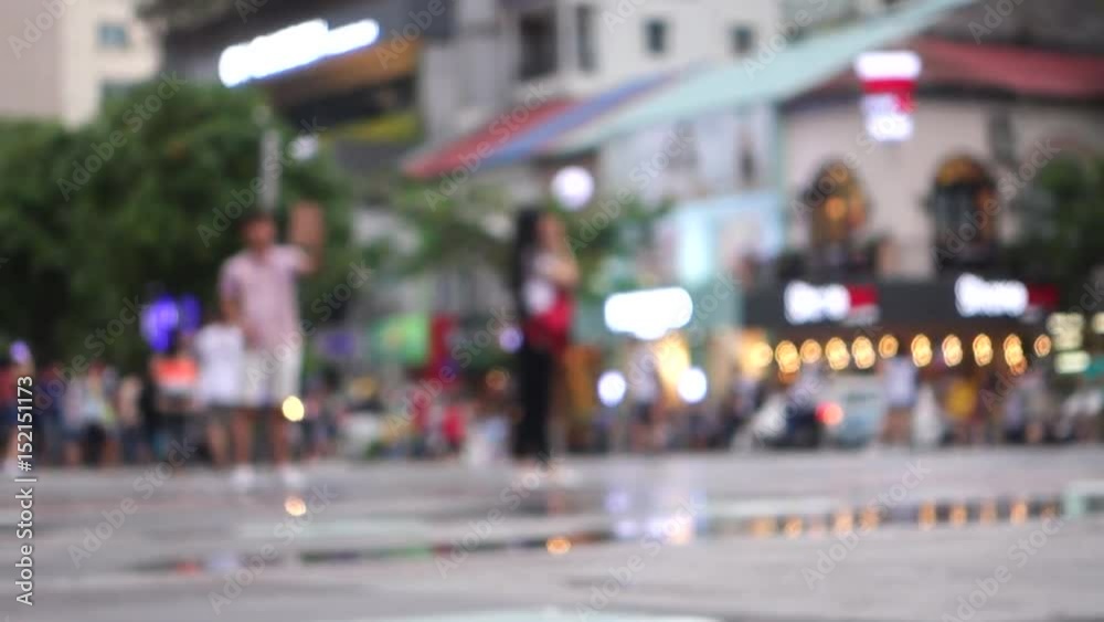 Blurred crowd of different people are walking in the city. Defocused background of city life Blurred crowd of different people are walking in the city. Defocused background of city life