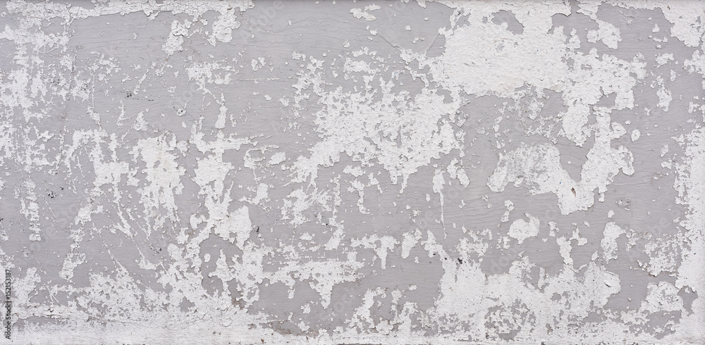 Fototapeta premium Cracked white paint on concrete