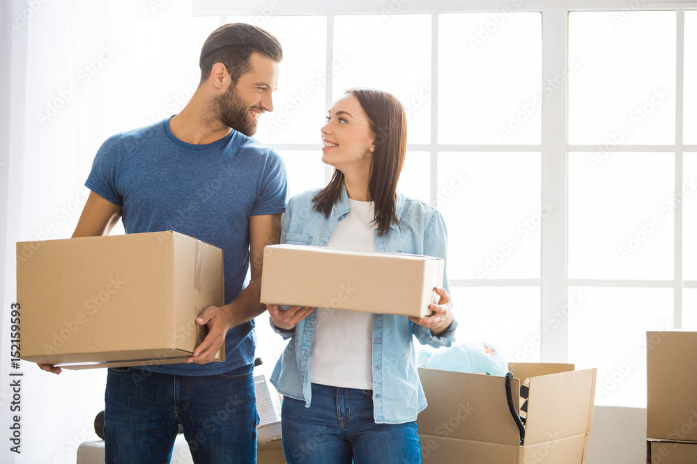 Young couple moving to a new apartment together relocation