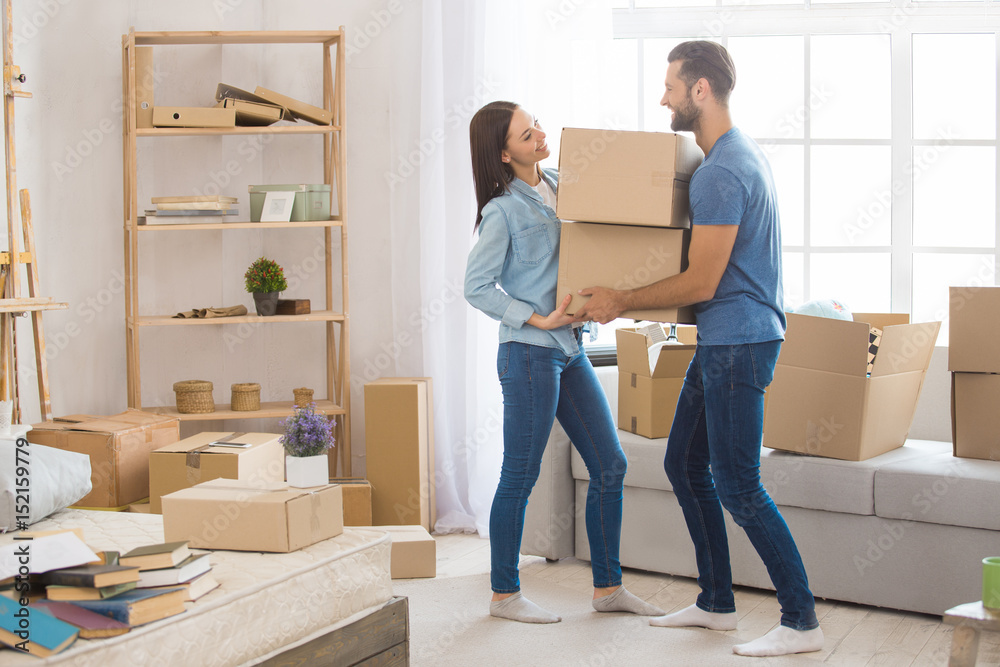 Young couple moving to a new apartment together relocation Young couple moving to a new apartment together relocation