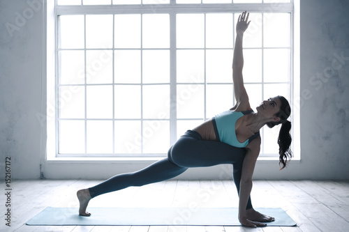 Fototapeta Naklejka Na Ścianę i Meble -  Young Woman Doing Yoga Pose Exercise Healthy Lifestyle