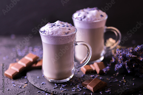 Cappuccino with lavender and chocolate syrup and flowers