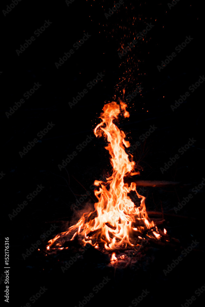 Fireplace with sparks in dark mountains