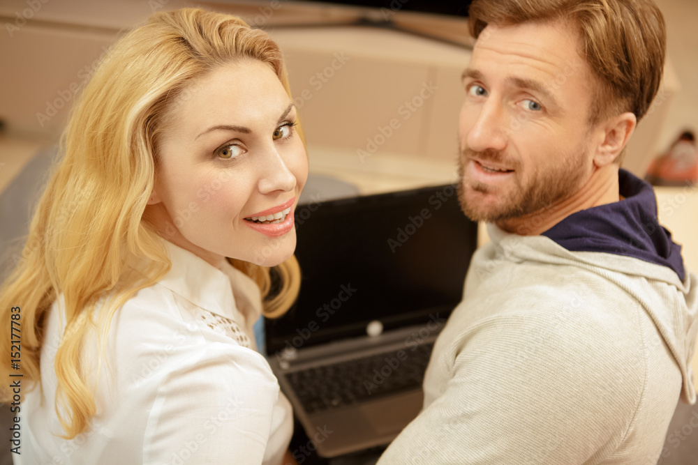 Gorgeous mature couple using laptop together at home Gorgeous mature couple using laptop together at home