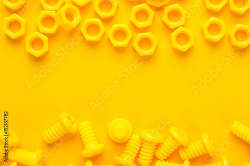 3d printed bolts and nuts on yellow background