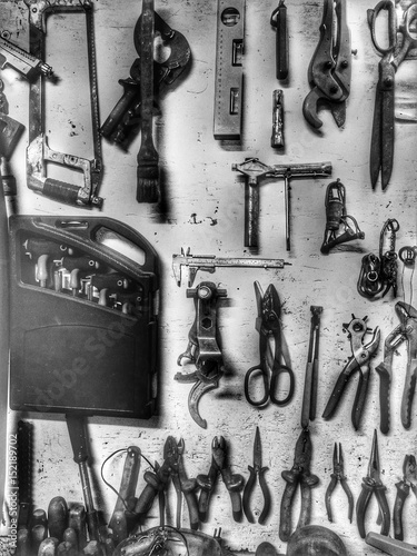 Mechanical utensils wall in a workshop on a light background