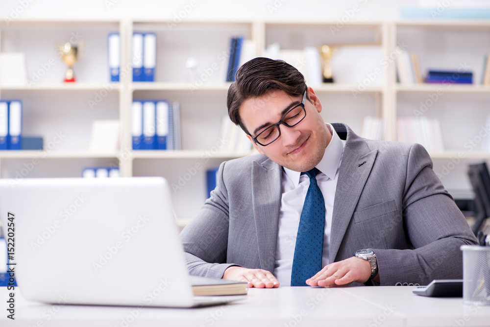 Businessman playing drums in office Businessman playing drums in office