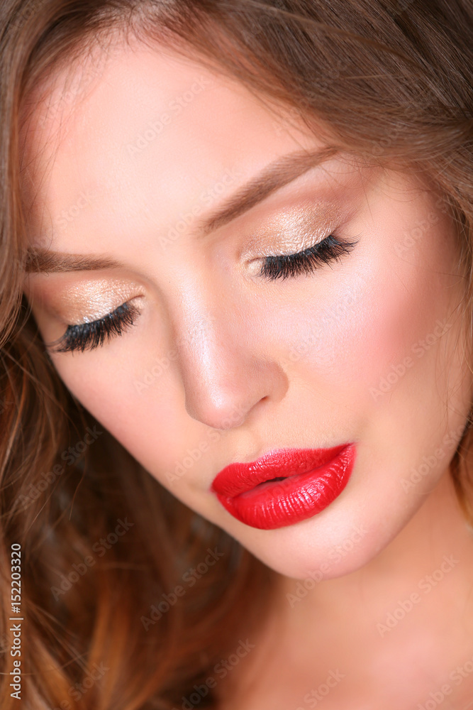 Beautiful woman skin with red lips on gray background Beautiful woman skin with red lips on gray background