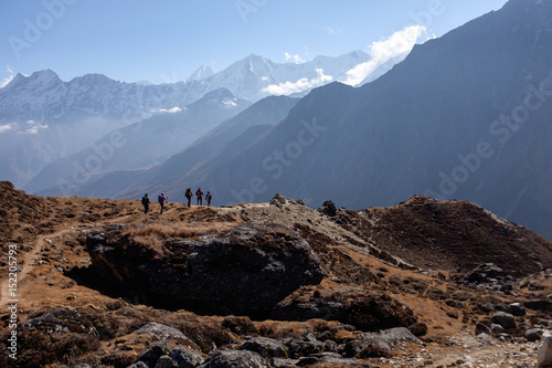 People in Himalaya mountains trekking down to the valley, finishing their journey after reaching Everest Base Camp