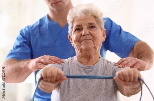 Physiotherapist working wit...
