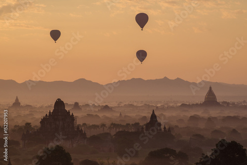 Hot air balloons fly over the Bagan plains during the morning sunrise in Myanmar.